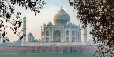 The Taj Mahal framed by tree branches, with the title "GOOD OMEN BOOKS 5 *STARS" above.